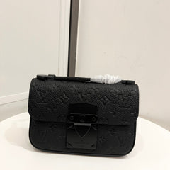 Embossed black chest bag