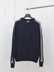 Knitted crew neck sweater with jacquard sleeves