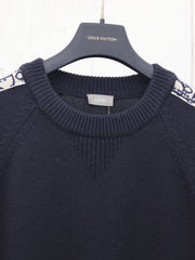 Knitted crew neck sweater with jacquard sleeves