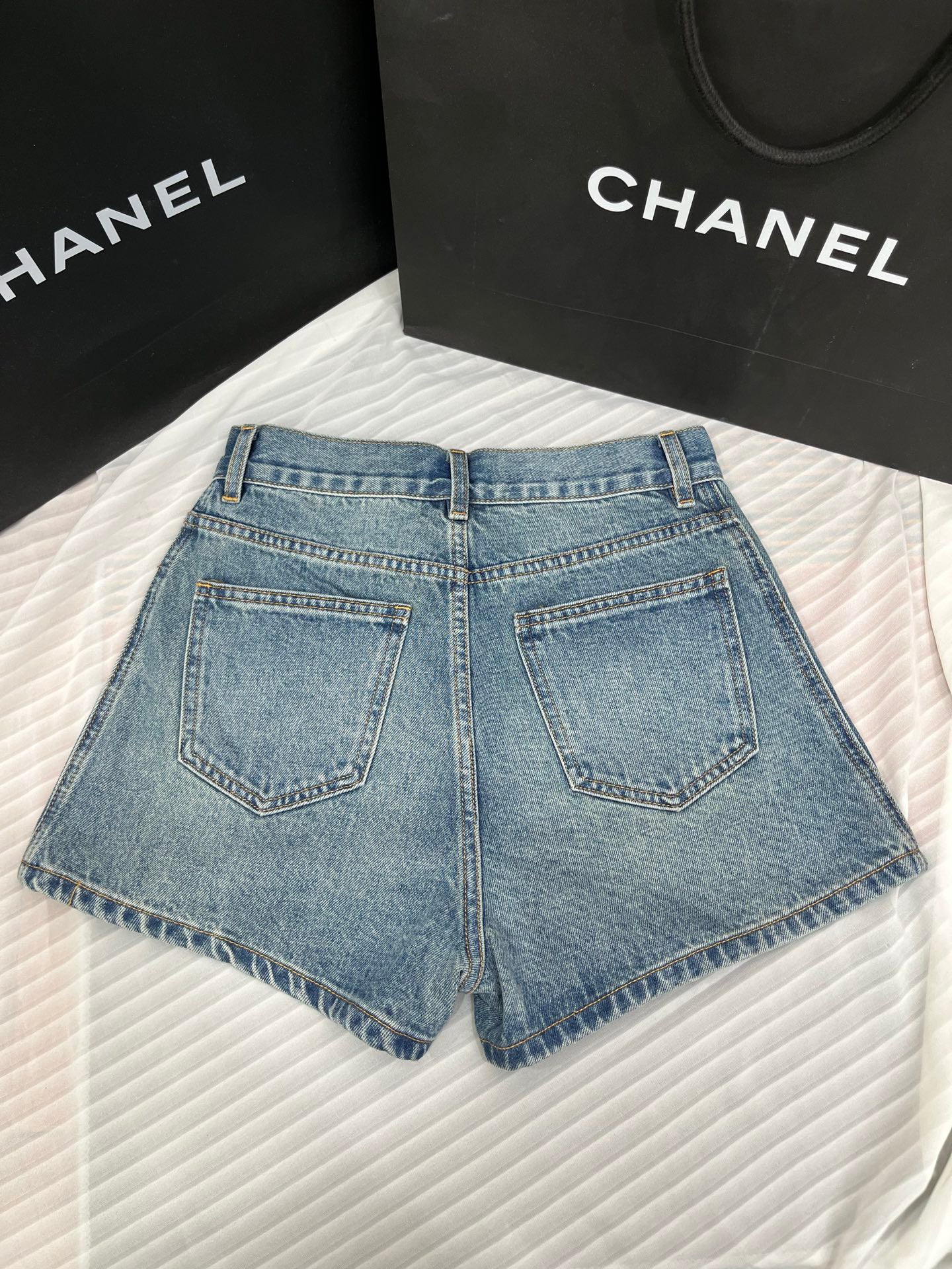 Washed mid-rise denim shorts