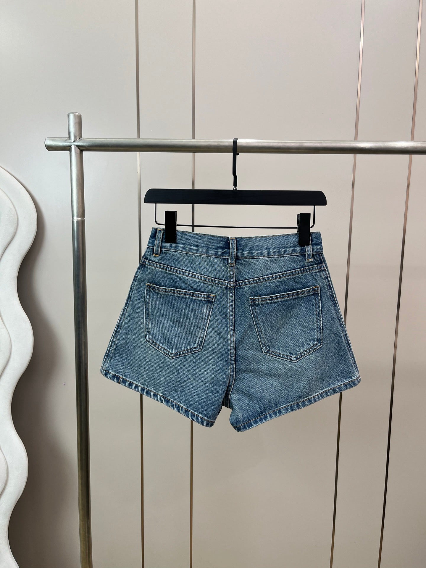 Washed mid-rise denim shorts