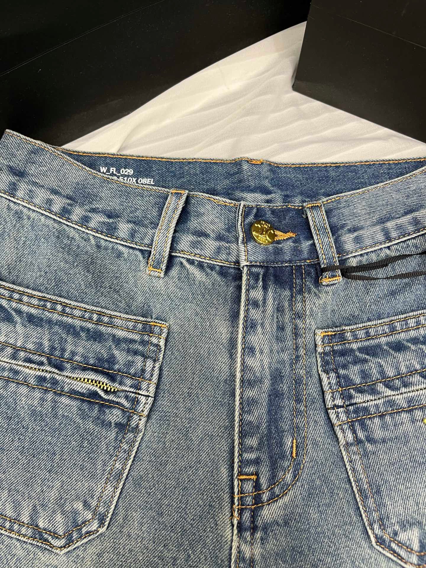 Washed mid-rise denim shorts