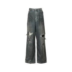 Mud-dyed distressed jeans